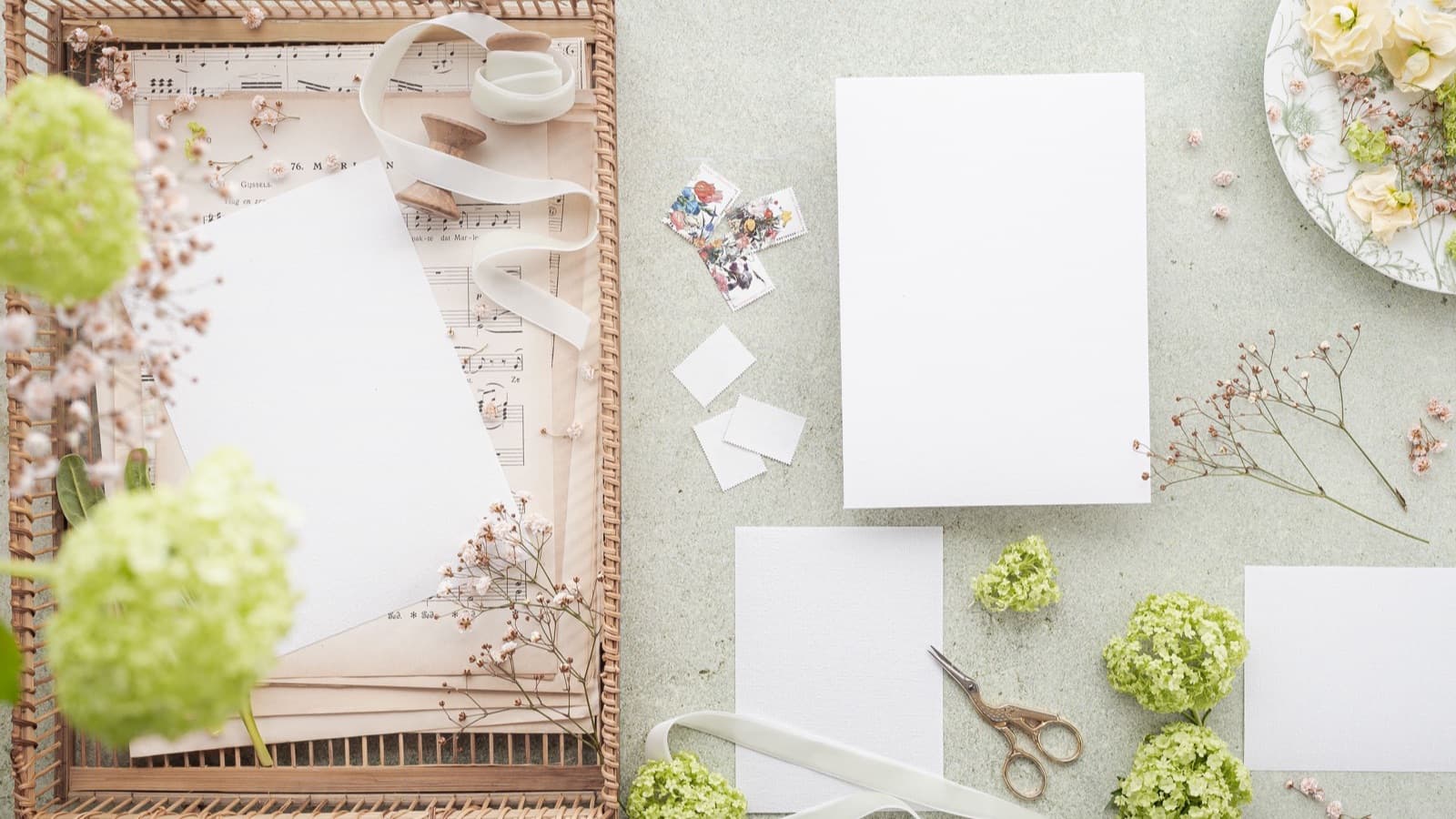 Elegant wedding stationery arranged beside fresh flowers